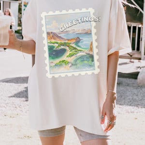 Maglietta con acquerello delle Galapagos, francobollo da viaggio vintage, maglietta unisex in cotone con cartolina dell'isola, vestibilità oversize dalla S alla 4XL