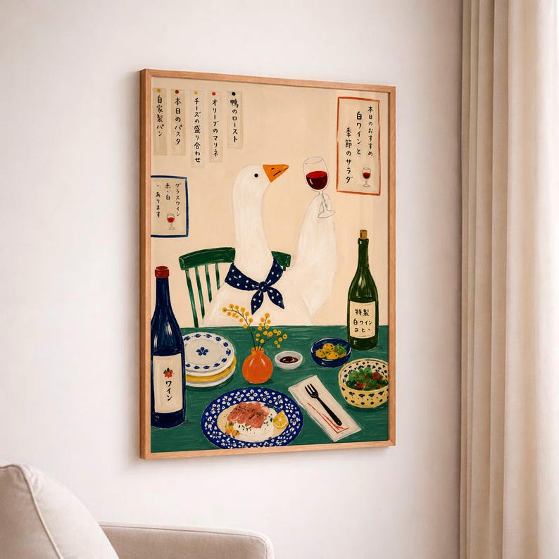 May include: A framed wall art print featuring a white goose wearing a blue polka dot neckerchief, holding a glass of red wine. The scene includes a green table with plates of food, a wine bottle, and Japanese text menus on a light beige background.
