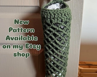 May include: A green crocheted bag dispenser hanging from a door handle. The bag is cylindrical with an open weave design, and a bundle of white bags is visible at the bottom. Text on the image reads "New Pattern Available on my Etsy shop."