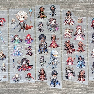 Puede incluir: Hojas de pegatinas transparentes con personajes medievales de estilo chibi. Las pegatinas representan caballeros, miembros de la realeza y personajes de fantasía en varios atuendos y poses. El texto "Medieval Chibi 10" es visible, junto con la firma del artista.