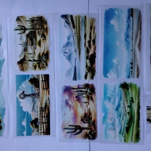 May include: A collection of landscape art prints featuring various scenes, including mountains, deserts with cacti, and coastal views. The prints are in a variety of colors, including blue, green, and brown. The text "BACKGROUNDS 20" is visible at the top left.