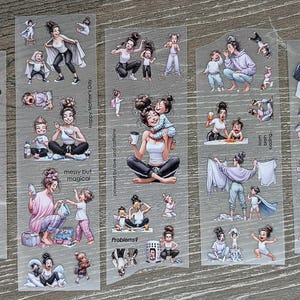 May include: A collection of clear sticker sheets featuring illustrations of a woman and children in various everyday scenarios. The stickers include text such as "Happy Mother's Day" and "messy but magical."