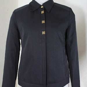 May include: A black long-sleeved button-up jacket with gold buttons. The jacket has a collar and a slightly cropped hem.