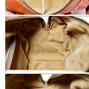 Puede incluir: Vista interior de un bolso de mano de cuero marr&oacute;n con forro de tela beige. El bolso tiene cierre de cremallera y un peque&ntilde;o bolsillo en el interior.