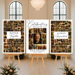 May include: Three memorial photo displays on wooden easels. Each display features a collage of photos. The center display reads "Celebrating the Life of Paul Deelan" with a central photo. The other displays read "Never Forgotten" and "Always Remembered".