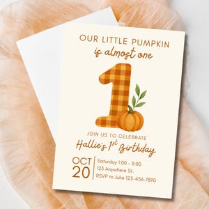 May include: A cream-colored birthday invitation with the text "OUR LITTLE PUMPKIN is almost one." It features a plaid number one, a pumpkin, and the text "Hallie's 1st Birthday." The date is October 20th.
