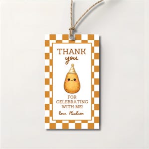 May include: A rectangular gift tag with a brown and white checkered border. The tag features the text "THANK YOU" above a cartoon potato wearing a party hat. The text "FOR CELEBRATING WITH ME!" and "love, Hudson" are also present.