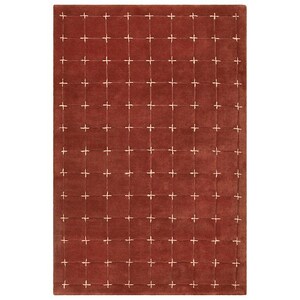 Pode incluir: Um tapete retangular cor de ferrugem com um padrão de grade de detalhes brancos em forma de cruz. O tapete tem uma textura macia e um design simples, adequado para vários estilos de interiores.