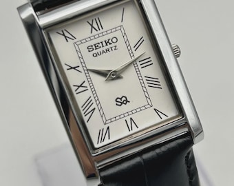 Reloj de pulsera vintage Seiko Slim Quartz para hombre con esfera blanca