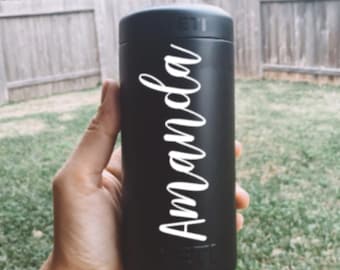 May include: Black Yeti Rambler with a white vinyl sticker that says "Amanda" on it.