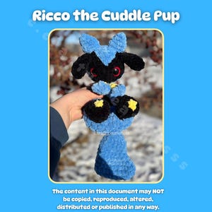 May include: A handmade crochet plush toy of a character named "Ricco the Cuddle Pup." The toy is primarily black and blue, with yellow accents. The image includes text that says "Ricco the Cuddle Pup" and copyright information.