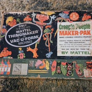 May include: A vintage Mattel Creeple Peeple Maker-Pak box featuring colorful monster illustrations on a black background. The box includes text detailing compatibility with Mattel Thingmaker or Vac-U-Form machines and instructions for making pencil toppers.