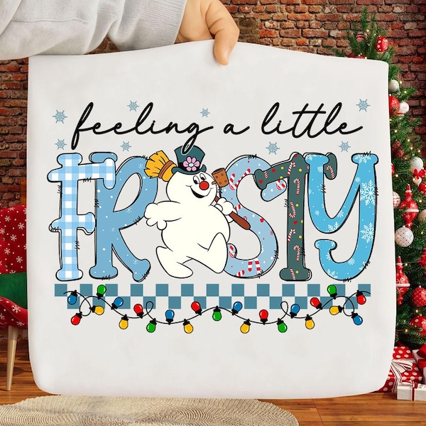 Lindo muñeco de nieve navideño PNG, Camiseta con estampado de hielo PNG, Navidad para niños pequeños PNG, Feliz Navidad PNG, Ambiente invernal navideño PNG
