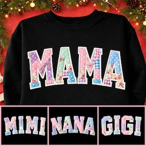 May include: Black sweatshirt featuring the word "MAMA" in patchwork lettering. The letters are crafted from diverse floral and polka dot fabrics. Below are the words "MIMI", "NANA", and "GIGI" in a similar style.