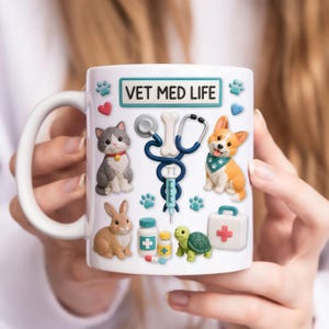 May include: White ceramic mug with the text "VET MED LIFE" and illustrations of a cat, dog, bunny, turtle, stethoscope, syringe, pills, and a first aid kit. The mug has a white handle.