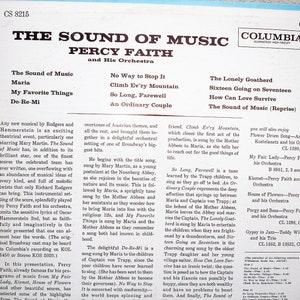 May include: A vintage vinyl record album cover for "The Sound of Music" by Percy Faith and His Orchestra. The cover displays the album title and song list in white text on a blue background. The Columbia Records logo is present.