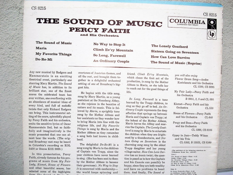 May include: A vintage vinyl record album cover for "The Sound of Music" by Percy Faith and His Orchestra. The cover displays the album title and song list in white text on a blue background. The Columbia Records logo is present.