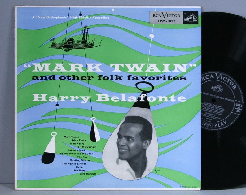 May include: Vintage vinyl record album cover for "Mark Twain" and other folk favorites by Harry Belafonte. The cover features a portrait of Belafonte, with a blue and green background and the RCA Victor logo.