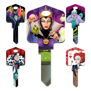 May include: Set of six decorative keys featuring Disney villains. The keys showcase characters like Maleficent, the Evil Queen, Ursula, Cruella de Vil, and the Queen of Hearts. Each key has a unique design and color scheme.