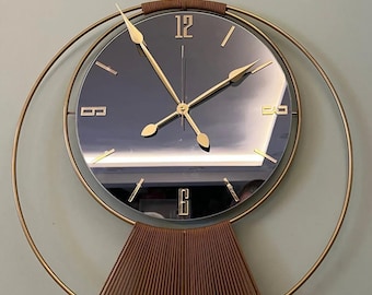 Gold Spiegel Wanduhr: Modernes skulpturales Pendel Design