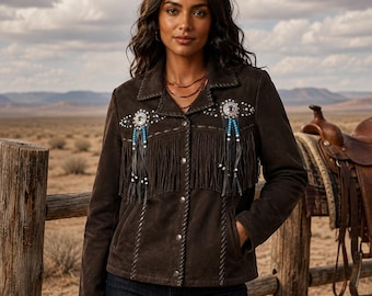 May include: A dark brown suede jacket featuring long fringe detailing across the chest, silver-toned metal concho accents, and turquoise bead embellishments. The jacket includes a collared neckline, a button-down front closure, and decorative stitching.