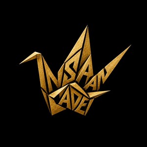 May include: A gold-colored origami crane sculpture featuring a textured, metallic surface. The word INSAN is integrated into the upper wing structure, while the word CADE is formed within the lower body section of the paper-folded bird design.