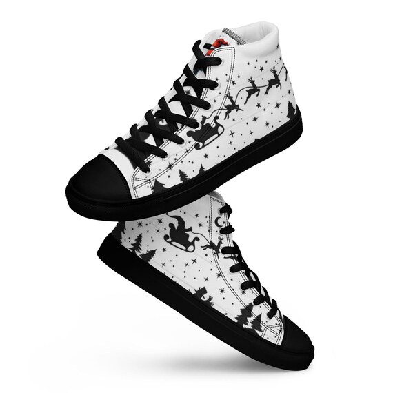 Women’s canvas shoes with Santa in black and white. Stars, snowman and Santa.