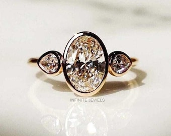 Oval Moissanite Engagement Ring, Bezel Set Three Stone, Pear Side Stones