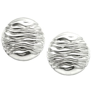 May include: A pair of silver oval-shaped earrings with a textured wavy design.