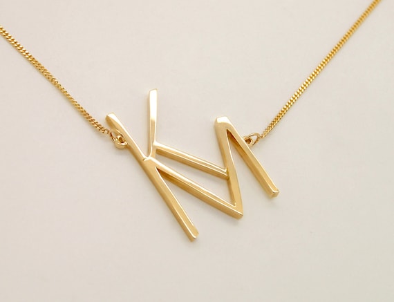 Tilted shop letter necklace