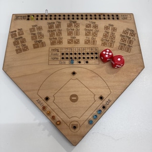 May include: A wooden baseball game board with etched details, including a baseball diamond, scoring areas, and dice-based play instructions. Two red dice are included. The board has the word "RUNS" at the top.