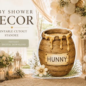 May include: A watercolor-style cutout standee of a honey pot with the word "HUNNY" on a label. The pot is brown with dripping honey. The image includes text that says "BABY SHOWER DECOR" and "PRINTABLE CUTOUT STANDEE".