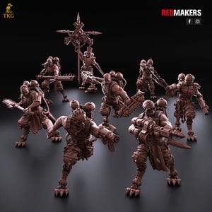May include: A group of brown miniature figurines of futuristic soldiers, each armed with various weapons and gear. The figures are posed in dynamic action stances, with detailed armor and weaponry. The background is dark, highlighting the figures.