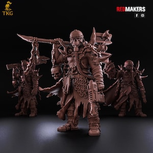 May include: Three brown warrior figurines with skull-shaped helmets and armor. The central figure holds a weapon over its shoulder. The figurines have detailed chainmail, shoulder pads, and other accessories. The image has the text "REDMAKERS" and "TKG".