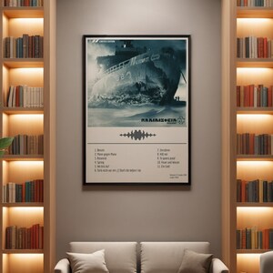 May include: A framed poster featuring a grayscale image of a ship in a snowy landscape. The poster includes the band name "Rammstein" and a list of song titles. The poster is labeled "Limited Edition".