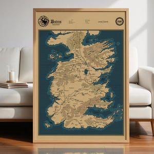 May include: A framed map of Westeros, featuring a detailed geographical representation with landmasses in tan and brown, surrounded by a dark blue ocean. The map includes text labels and is encased in a wooden frame. The top of the map has the word "Westeros".