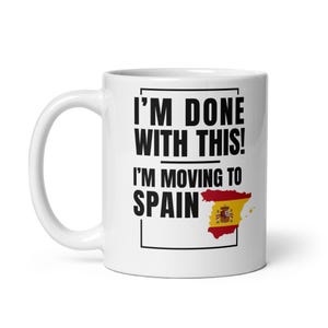 May include: White ceramic mug with the text "I'M DONE WITH THIS! I'M MOVING TO SPAIN" in black, with a red and yellow Spain map graphic. The mug has a curved handle and is designed for hot beverages.