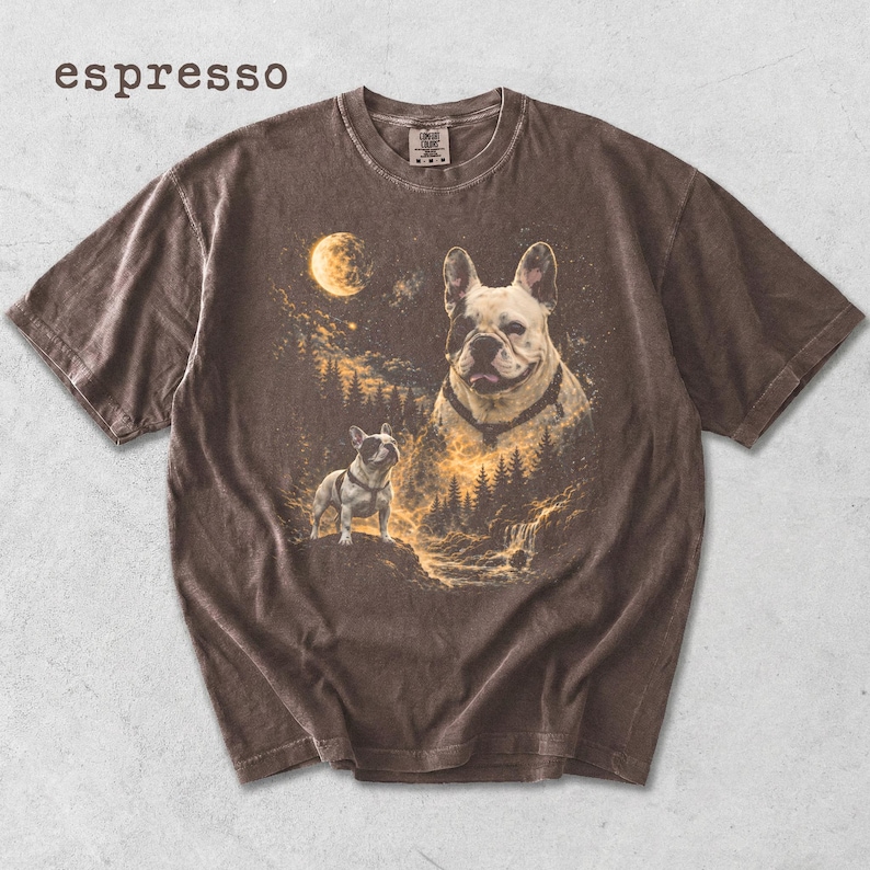 May include: A brown short-sleeve t-shirt with the word espresso printed in the top left corner. The graphic features two French bulldogs in a forest landscape under a full moon, with a large dog portrait and a smaller dog standing on a rock.