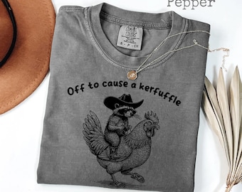 Comfort Colors® Off to Cause a Kerfuffle cowboy raccoon riding chicken Shirt, Sarcastic Shirts, Funny Sayings, Adult Humor Shirt