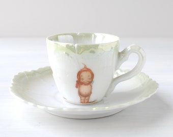 Antique Kewpie tea cup & saucer, child's toy porcelain tea set, Rose O'Neill vintage white green lustre transferware, Luchtenburg, Germany