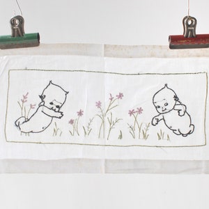 Antique Kewpie embroidered cloth, 1910s, Rose O&#39;Neill, vintage stitched white fabric embroidery, pale pink purple flowers, nursery decor
