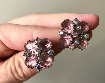 Pair of 1950s-1960s purple and aurora borealis rhinestone clip-on earrings, prong set stone, open back