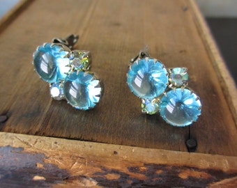 Looking glass. Vtg rhinestone clip-on earrings / prong set / glass cabochon blue AB aurora borealis silvertone / open  back