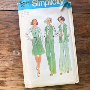 May include: Vintage Simplicity sewing pattern number 6811 for a women's outfit. The pattern includes two sizes, 18 to 20 and 40 to 42. The pattern shows three women wearing different versions of the outfit, all in green and white.