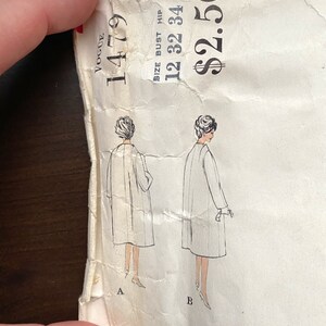 Pode incluir: Um padr&atilde;o de costura vintage da Vogue para um casaco. O n&uacute;mero do padr&atilde;o &eacute; 1479. O tamanho &eacute; 12-32-34. O pre&ccedil;o &eacute; de 2,50 &euro;.