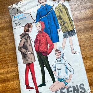 May include: Vintage Vogue sewing pattern for teens, featuring four different coat styles. The pattern is printed on paper and shows illustrations of the coats in various colors, including blue, red, and white.