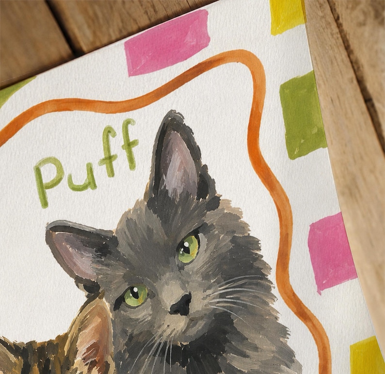 May include: A watercolor painting of a fluffy gray cat with green eyes. The word Puff is written in green letters above the cat. The background features a wavy orange line and scattered pink, yellow, and green rectangular shapes on white paper.