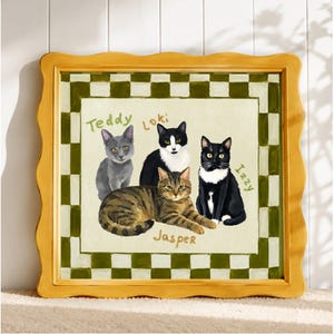 May include: A framed painting featuring four cats: a grey cat labeled Teddy, a black and white cat labeled Loki, a black and white cat labeled Izzy, and a brown tabby cat labeled Jasper. The border has a green and white checkered pattern.