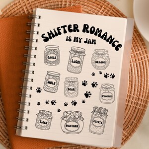 May include: Spiral-bound notebook with the text "SHIFTER ROMANCE IS MY JAM". The notebook features illustrations of jars labeled with animal names like Eagle, Lion, Dragon, Wolf, Bear, Phoenix, Tiger, Panther, and Coyote.