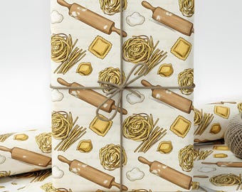 May include: A wrapped gift with a beige background featuring a repeating pattern of pasta, rolling pins, and clouds. The pasta includes fettuccine, ravioli, and nests of tagliatelle. The gift is tied with twine.